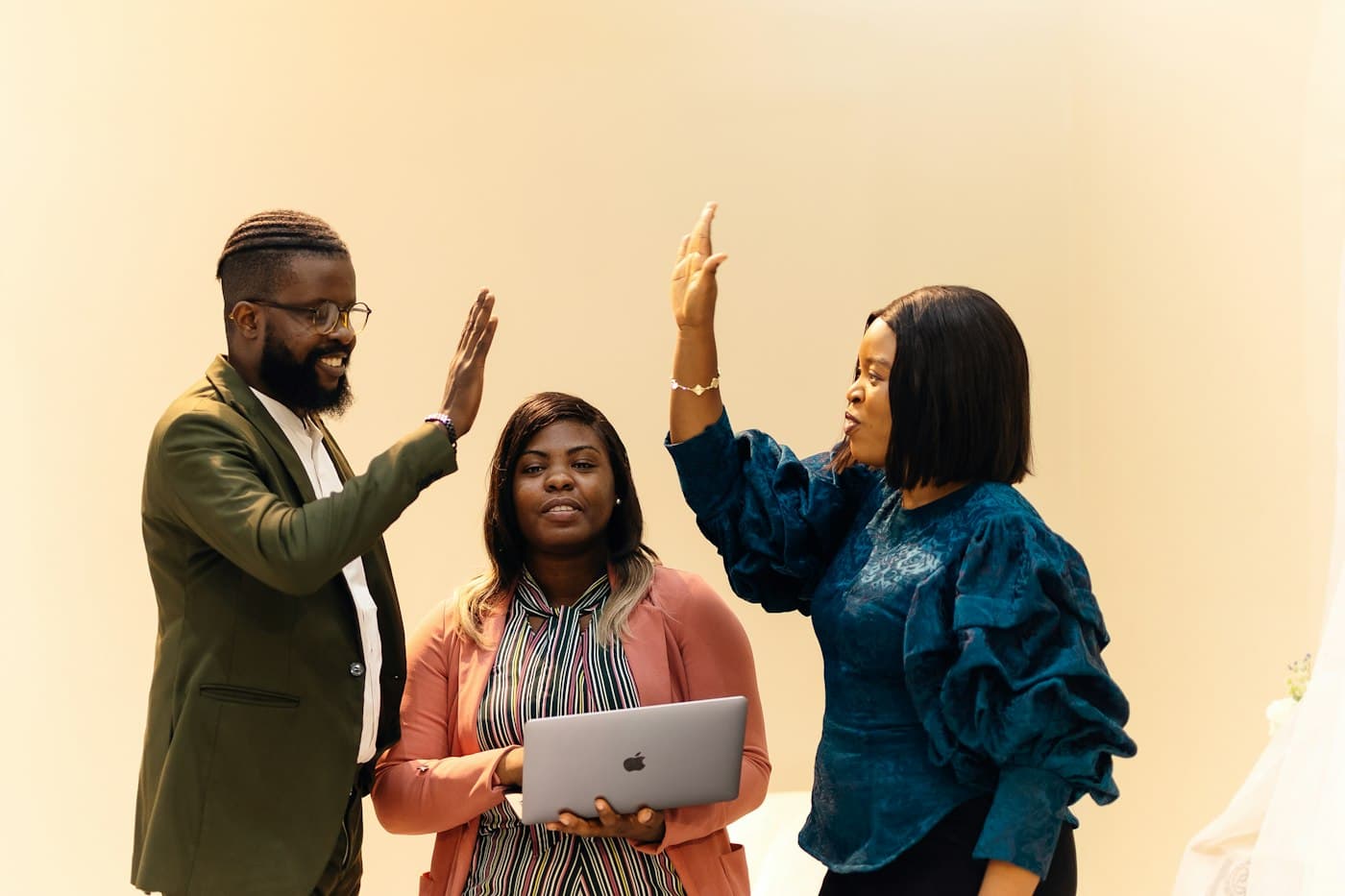 Colleagues high-fiving after a successful project